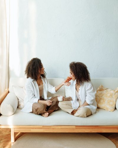 Two Women Sitting on the Couch